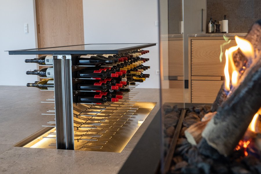 Custom-made wine cellar with lift and elegant glass cover