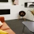 Free-standing circular bioethanol fireplace with three legs of oak wood