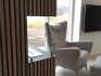 Foco Corner Left 1200 - Modern corner bioethanol fireplace with a sleek black frame and vibrant flames.