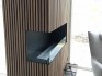 Foco Corner Left 1200 - Modern corner bioethanol fireplace with a sleek black frame and vibrant flames.