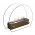 Circular tabletop fireplace wit glass panels on the sides