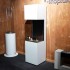 Elegant and tall freestanding fireplace in white with three glass panels